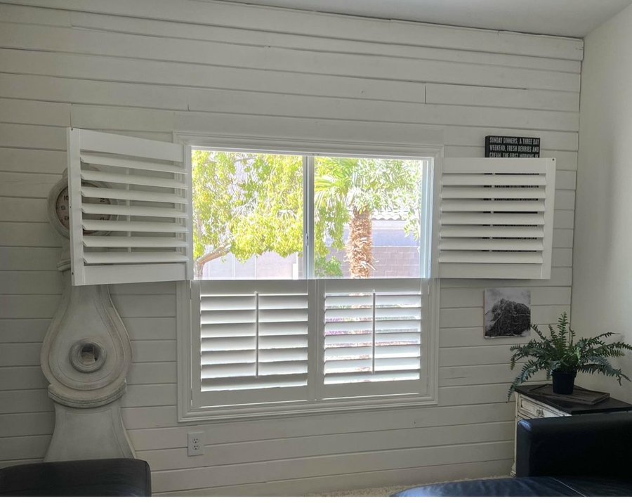 Classic plantation shutters in a Las Vegas living room by Moonlight Window Fashions